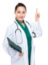 Female doctor hold clipboard and finger point out Royalty Free Stock Photo