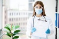 Female doctor hold clipboard pad and fill medical history list