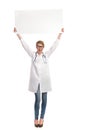 Female doctor holding banner abover her head. Royalty Free Stock Photo