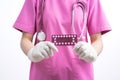 Female doctor holding birth control pills. Contraceptives in hands for safe sex, concept of pharmacist, drugs, diet pill, Royalty Free Stock Photo