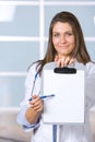 Female doctor holding blank chart Royalty Free Stock Photo