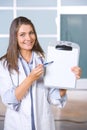 Female doctor holding blank chart Royalty Free Stock Photo