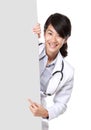 Female doctor holding blank white board Royalty Free Stock Photo