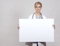 Female doctor holding board Royalty Free Stock Photo