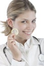 Female Doctor holding condoms Royalty Free Stock Photo