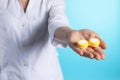 Female doctor holding contact lens case on color background, closeup Royalty Free Stock Photo