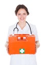 Female doctor holding first aid box Royalty Free Stock Photo