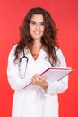 Female doctor holding a folder and stethoscope Royalty Free Stock Photo