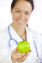 Female Doctor Holding Green Apple Royalty Free Stock Photo