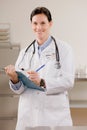 Female doctor holding medical chart Royalty Free Stock Photo