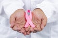 Female doctor holding pink breast cancer ribbon Royalty Free Stock Photo