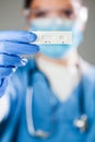 Female doctor holding Rapid Diagnostic Test serological test kit Royalty Free Stock Photo