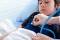 Female doctor holding a stethoscope to check the pulse of the heartbeat Royalty Free Stock Photo