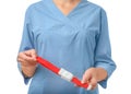 Female doctor holding tourniquet on white, closeup. Medical object