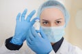 Female Doctor holding a vial of white drug powder antibiotics