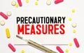 Female doctor holds paper board with text words PRECAUTIONARY MEASURES Royalty Free Stock Photo