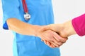 Female doctor the hospital giving a handshake Royalty Free Stock Photo