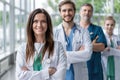 Female doctor at the hospital with her team. Royalty Free Stock Photo