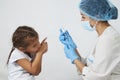 Female doctor injecting vaccine to girl Royalty Free Stock Photo