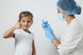 Female doctor injecting vaccine to girl Royalty Free Stock Photo