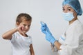 Female doctor injecting vaccine to girl Royalty Free Stock Photo