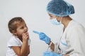 Female doctor injecting vaccine to girl Royalty Free Stock Photo