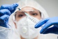 Female doctor or lab scientist holding syringe,filling injection with liquid vaccination dose Royalty Free Stock Photo