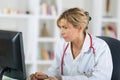 female doctor looking at computer in hospital Royalty Free Stock Photo
