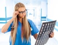 Female doctor looking at tomogram Royalty Free Stock Photo