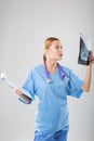 Female doctor looking at an x-ray of the patient Royalty Free Stock Photo