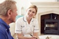 Female Doctor Making Home Visit To Senior Man For Medical Check Royalty Free Stock Photo