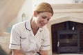 Female Doctor Making Home Visit To Senior Woman For Medical Check Royalty Free Stock Photo