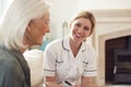 Female Doctor Making Home Visit To Senior Woman For Medical Check Royalty Free Stock Photo