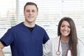 Female Doctor and male nurse smiling in office Royalty Free Stock Photo