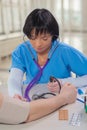 Female doctor measuring blood presure Royalty Free Stock Photo