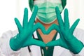 Female doctor  medical mask and hands in latex glove shows Royalty Free Stock Photo