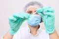 Female doctor in medical mask ready to make injection Royalty Free Stock Photo