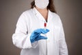 Female Doctor in medical mask ready to make injection Royalty Free Stock Photo