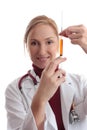 Female doctor with medical syringe