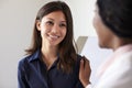 Female Doctor Meeting With Patient In Exam Room