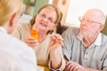 Female Doctor or Nurse Explaining Prescription Medicine to Senior Adult Couple Royalty Free Stock Photo