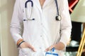 Female doctor or nurse with lgbt bracelet on her hand close up.