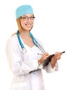 Female Doctor or Nurse with Stethoscope Writing in Note Pad Royalty Free Stock Photo