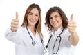 Female doctor and nurse with thumb up