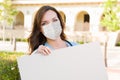 Female Doctor or Nurse Wearing Protective Face Mask Holding Blank Sign Royalty Free Stock Photo