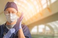 Female Doctor or Nurse Wearing Protective Face Mask and Surgical Gloves In Hospital Royalty Free Stock Photo