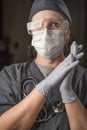 Contemplative Female Doctor or Nurse Wearing Scrubs, Protective Face Mask and Goggles Royalty Free Stock Photo