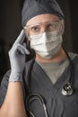 Pensive Female Doctor or Nurse Wearing Scrubs, Protective Face Mask and Goggles Royalty Free Stock Photo