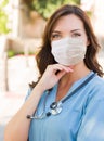 Female Doctor or Nurse Wearing Protective Face Mask Royalty Free Stock Photo