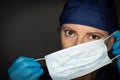 Female Doctor or Nurse Wearing Surgical Gloves Putting On Medical Face Mask Royalty Free Stock Photo